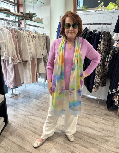 woman in pink top with multicolored scarf