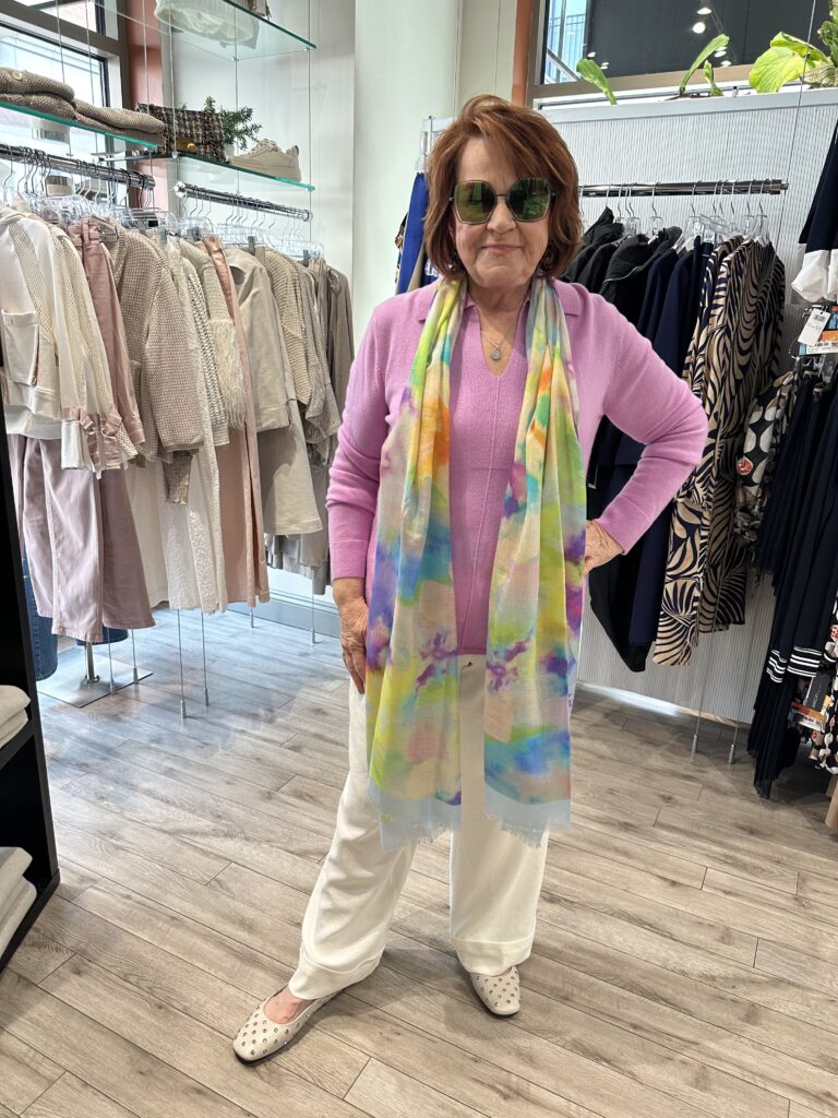 woman in pink top with multicolored scarf