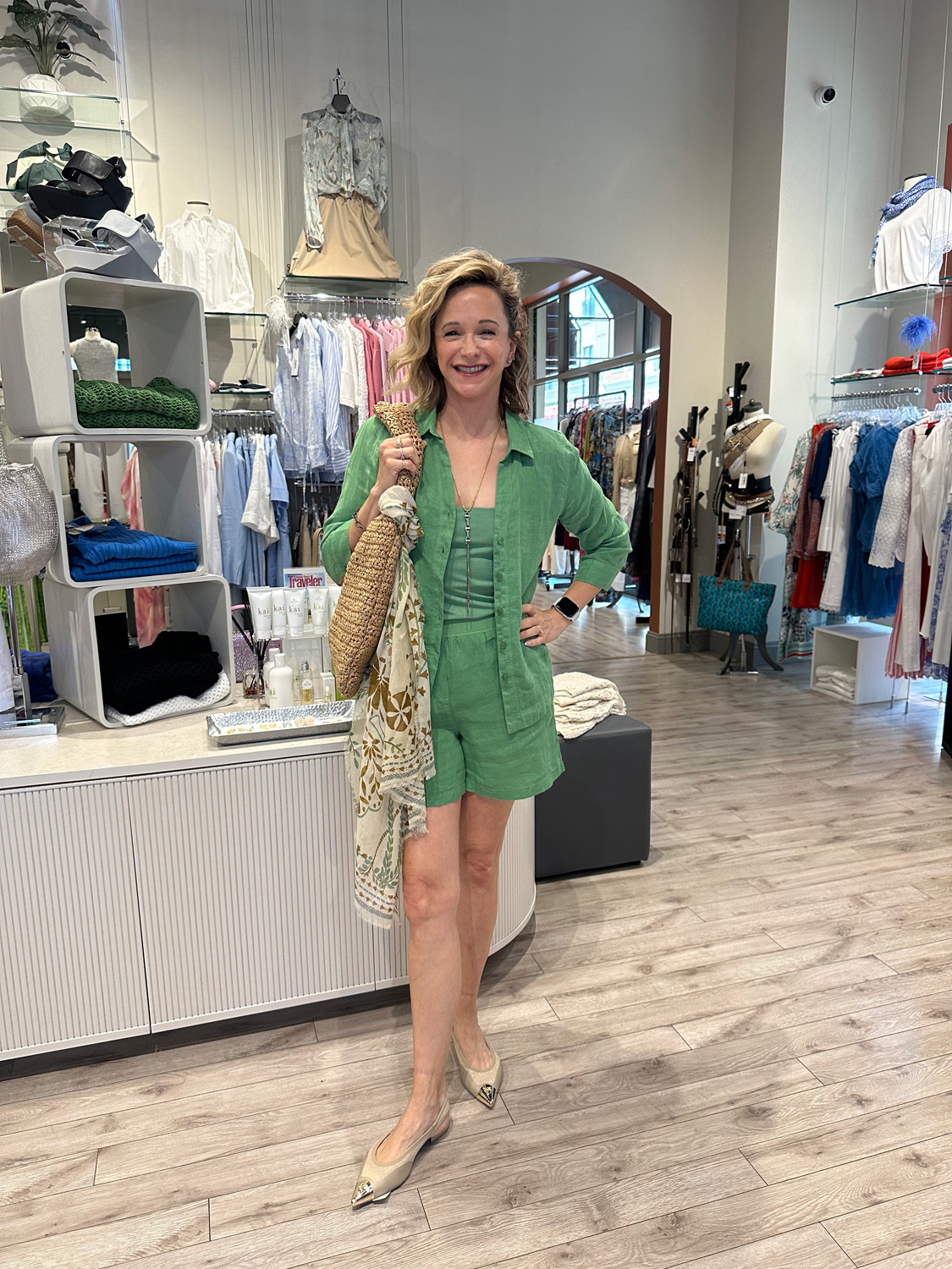 Capsule Outfit 3 Store owner wearing matching green capsule outfit stands confidently in the center of Fringe & Form boutique.