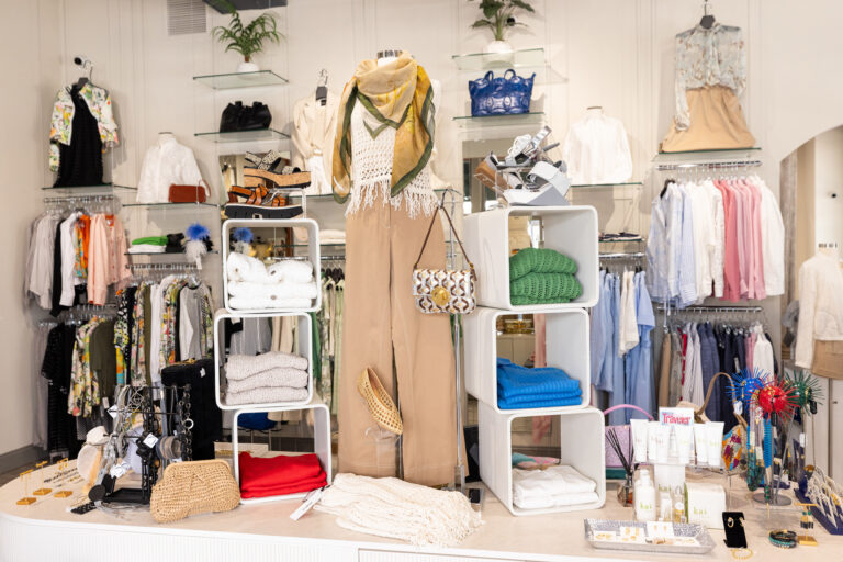 Boutique interior with open layout and modern clothing racks.